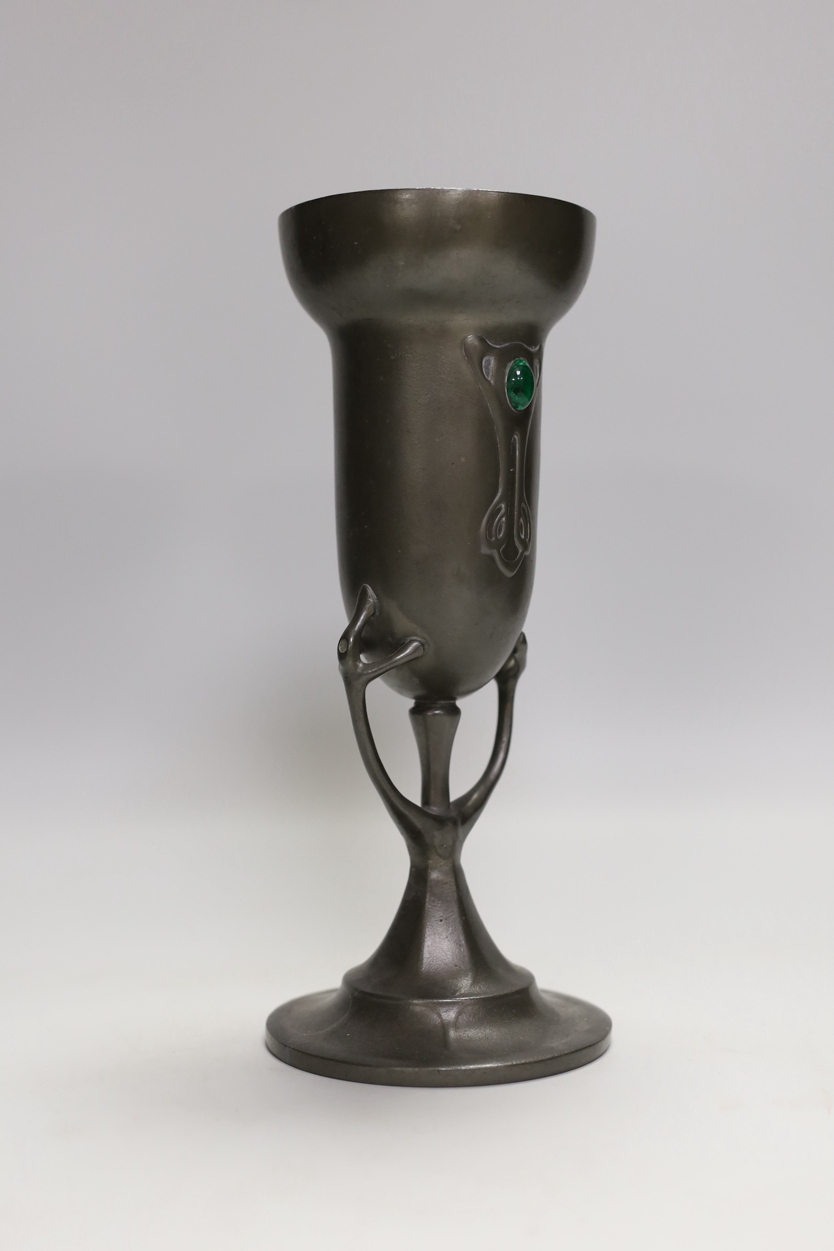 An Art Nouveau pewter vase with glass inset cabochon, 23cm